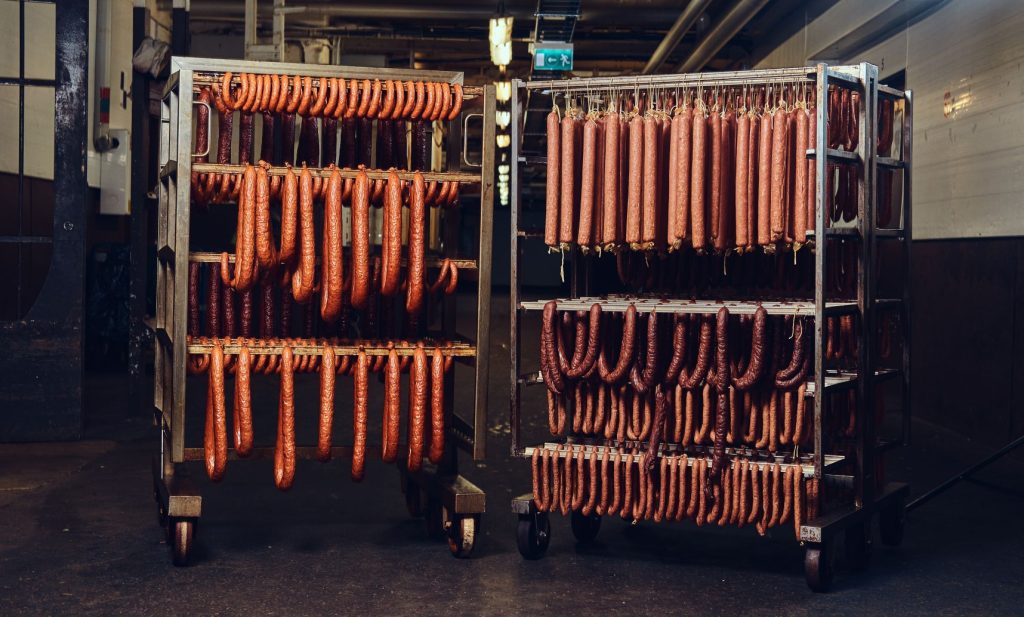 Sausages in the factory freezer storage.